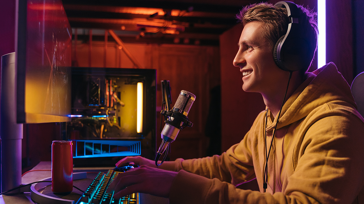 Young guy pro cyber sportsman streaming live video from esport tournament