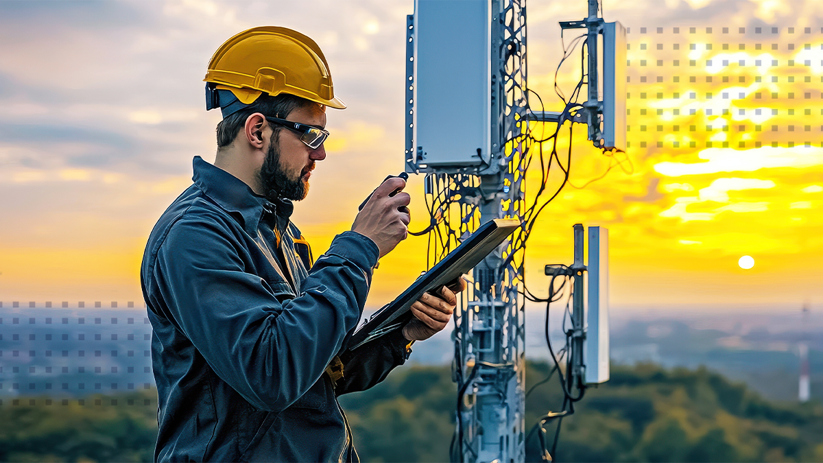 A technician in a helmet inspects a telecommunications tower during sunset, showcasing the blend of technology and nature