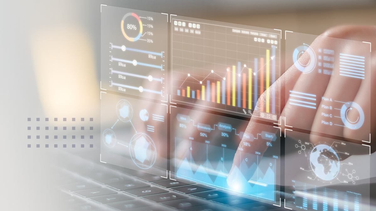 A person interacts with a transparent digital analytics dashboard over a laptop keyboard. Multiple data visualizations