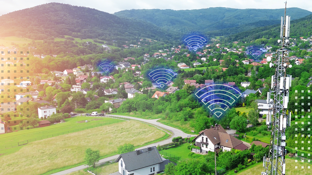 aerial view of neighborhood with internet poles connecting wi-fi
