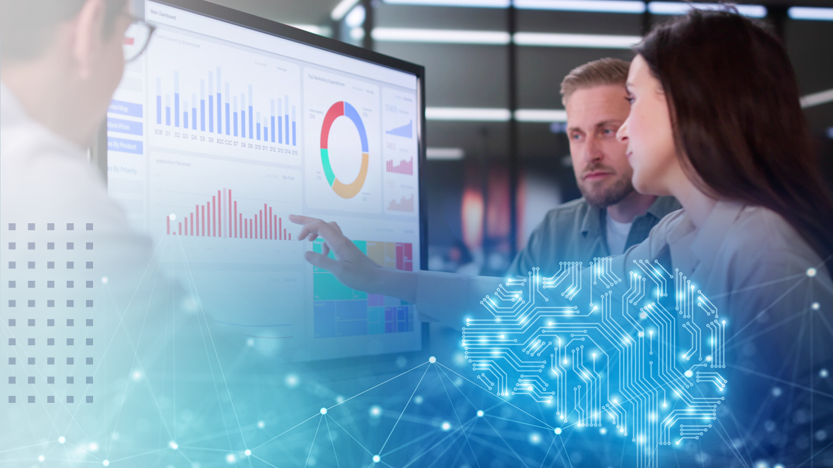 A woman pointing at a monitor with analytics data charts and graphs with abstract networking icons overlaid