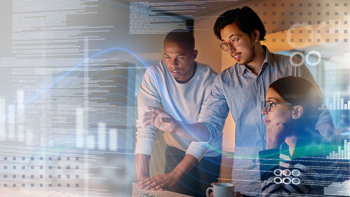A small team of professionals collaborates around a computer screen in a dimly lit office. Digital charts, graphs, and interface elements are overlaid, suggesting data analytics and modern technology. One person points at the screen while others focus intently, indicating problem-solving and teamwork. The scene conveys a high-tech, innovative atmosphere with a cool, futuristic visual style.