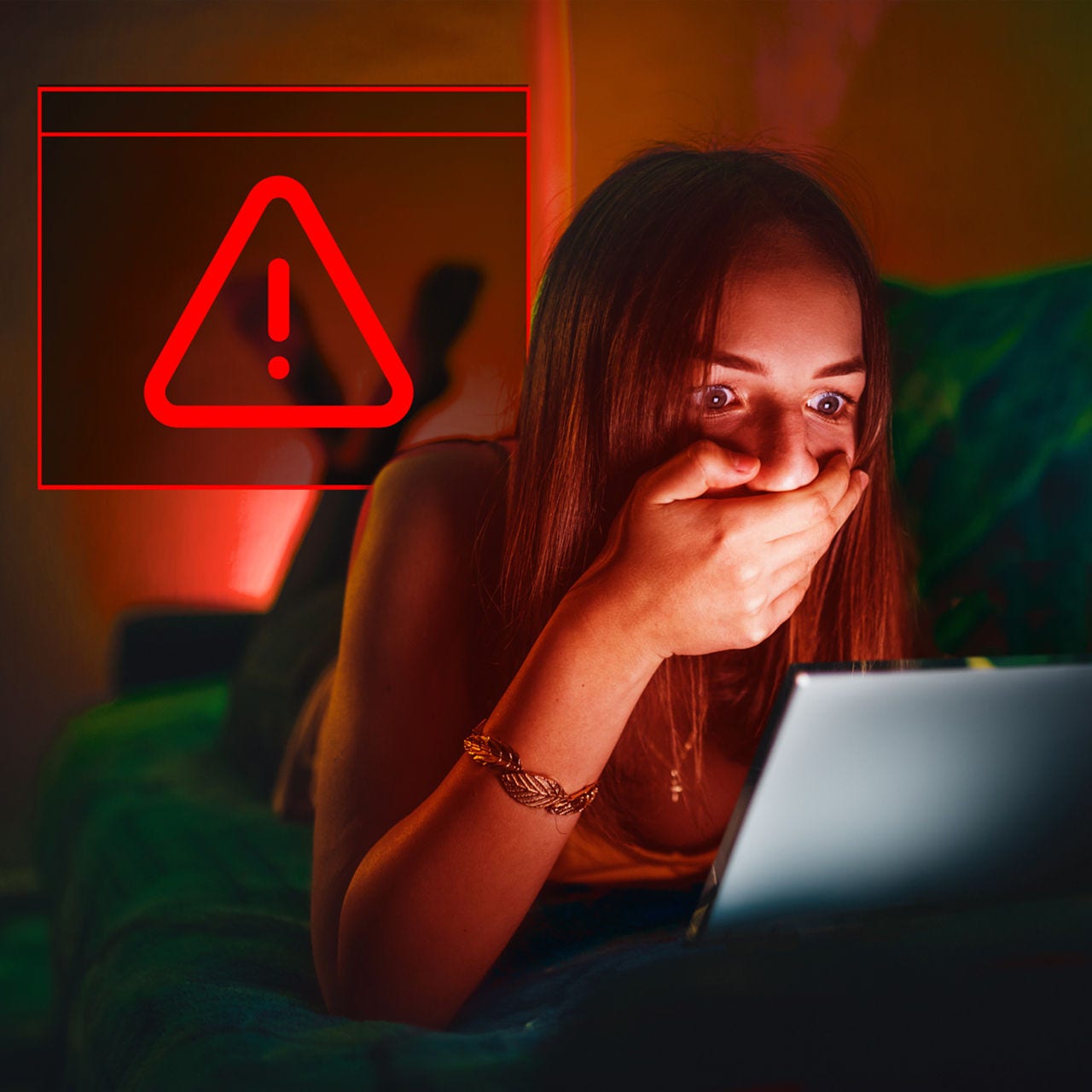 red alert symbol appears on girls laptop