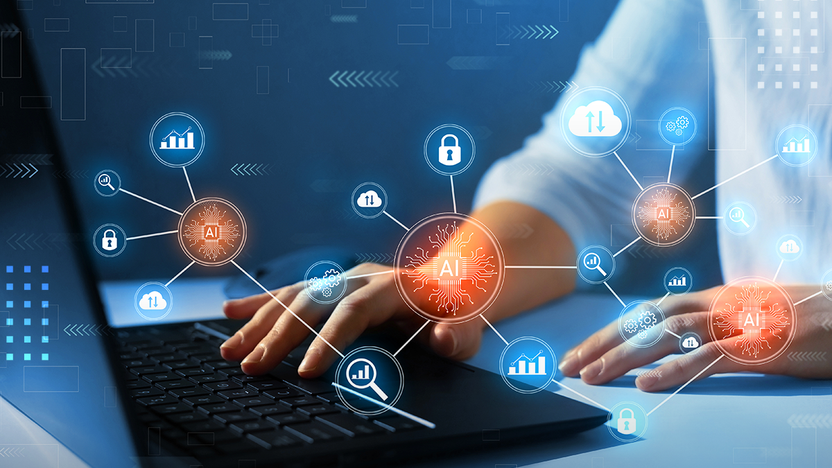 Hands typing on laptop with AI technology graphics