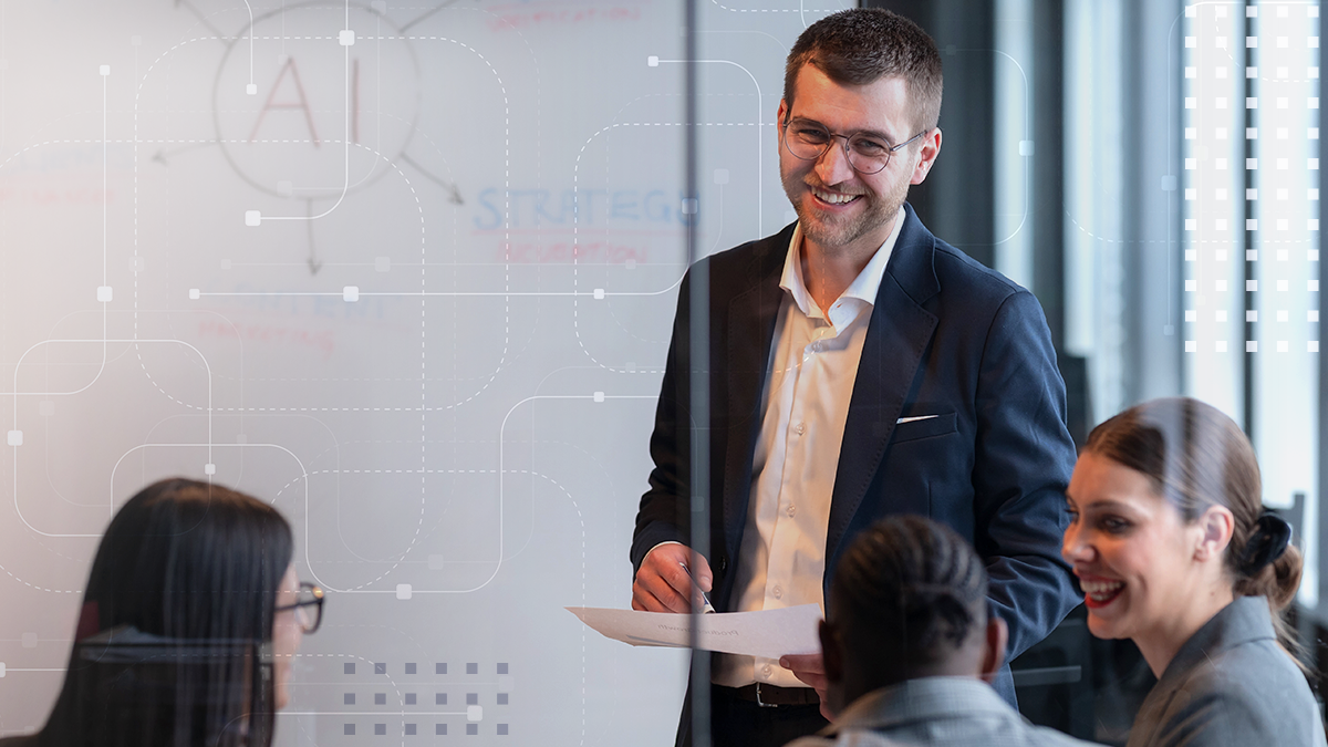 Smiling colleagues in a meeting room doing a presentation on AI-powered marketing