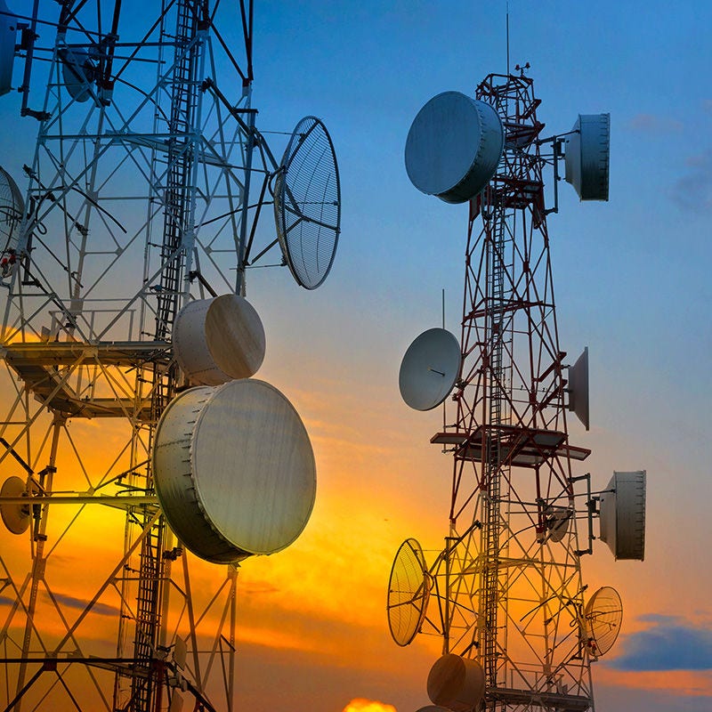 radio towers at sunset