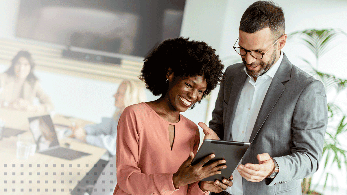 Business people using tablet discussing ideas in office