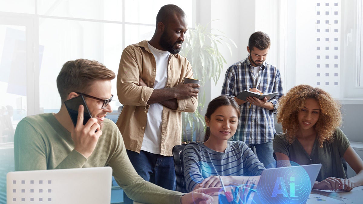 A diverse group of young professionals collaborates in a bright modern office. One person talks on a phone while another stands with a coffee cup, and others work together at a laptop. A subtle AI graphic overlay appears near the laptop, suggesting technology and innovation. Large windows and soft daylight create an open, productive atmosphere.