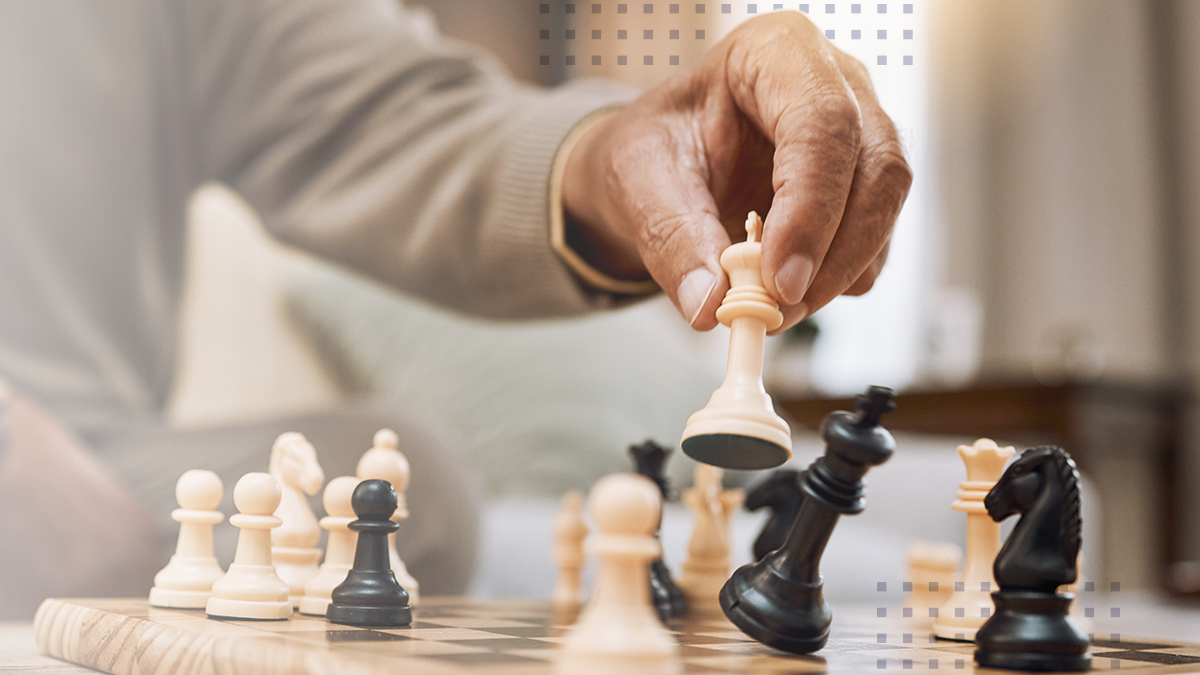 Man, playing hands and chess king in house, home living room or apartment in winner strategy, checkmate or board game success.