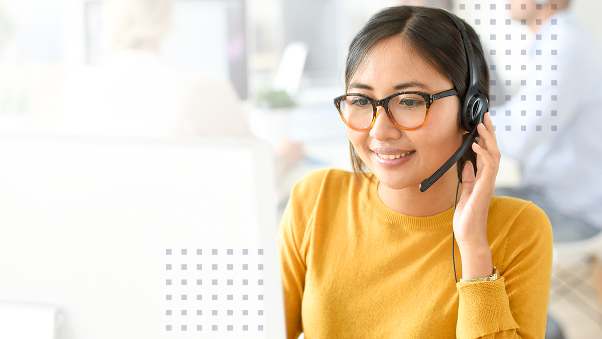 A woman with a headset on providing customer service excellence