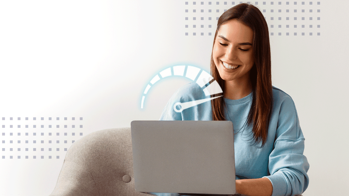 Smiling woman working on laptop in home office space
