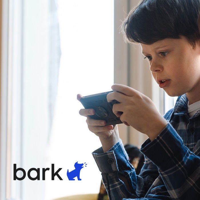 Boy with mobile device and Bark logo