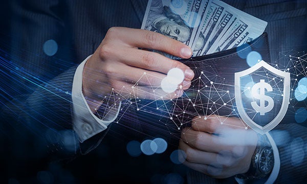Close up of businessman hands holding money. Business money insurance and protection concept.