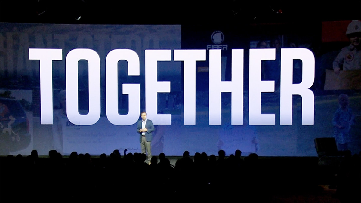 Word "together" on stage screen