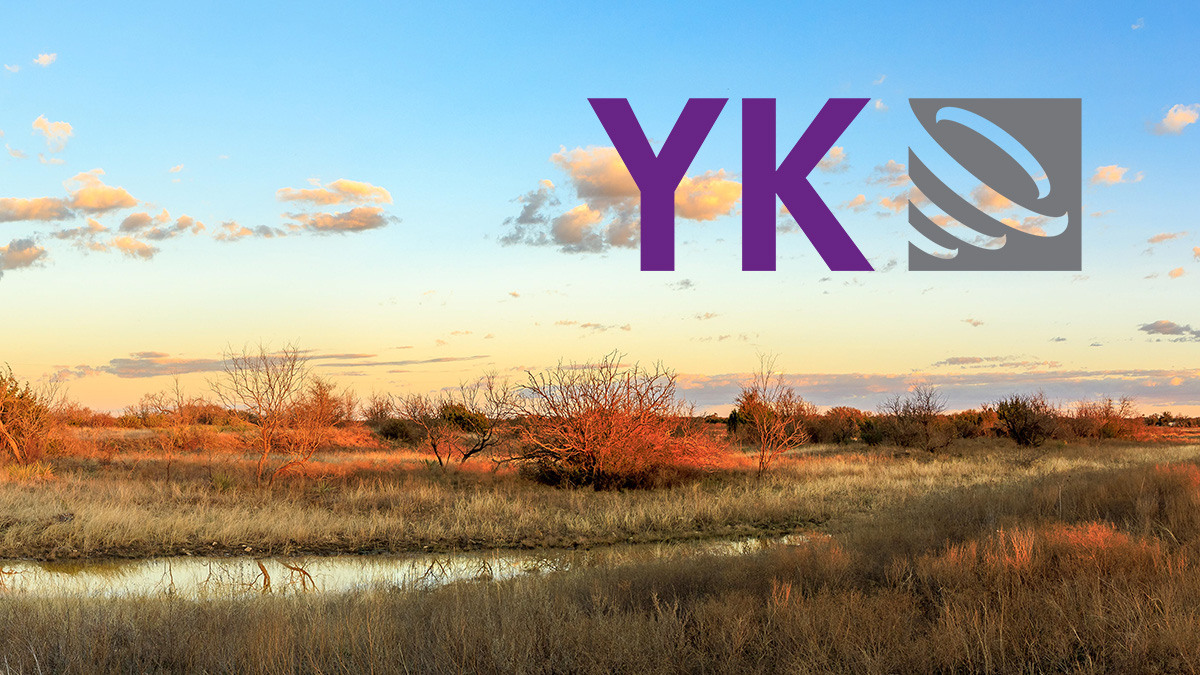 YK logo over prairie