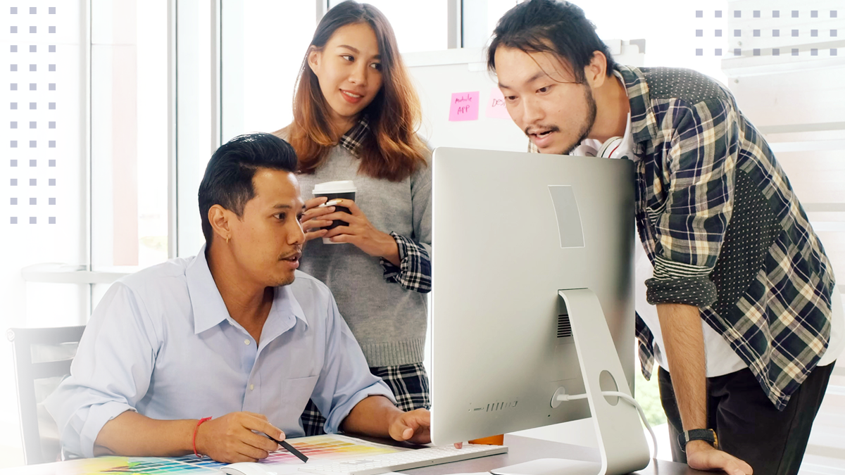 Young motivated asian business team discussing oh business strategy in the modern office