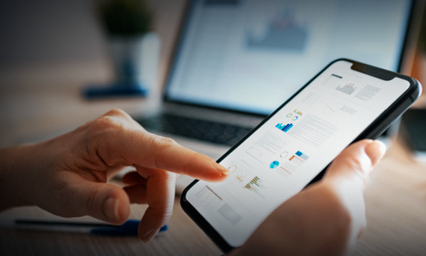 Close up photo of woman using mobile app for finance
