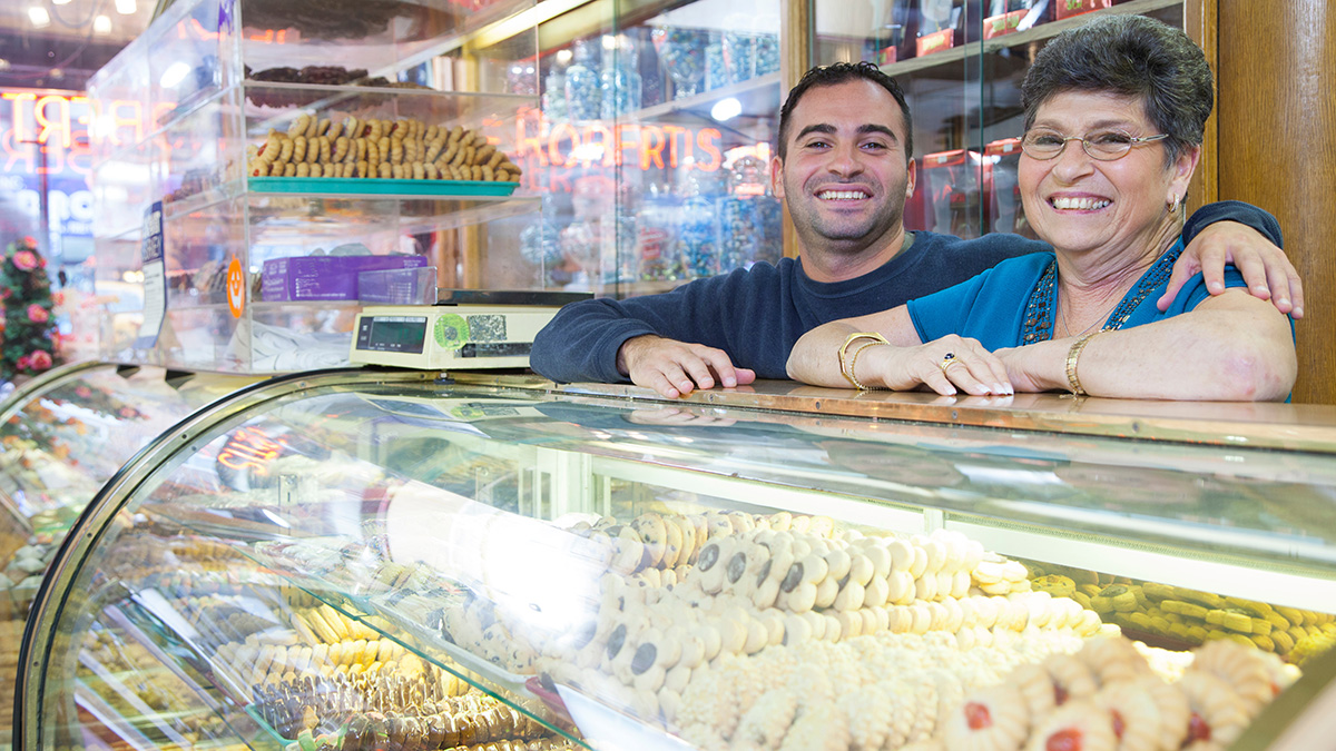 smiling bakery owners